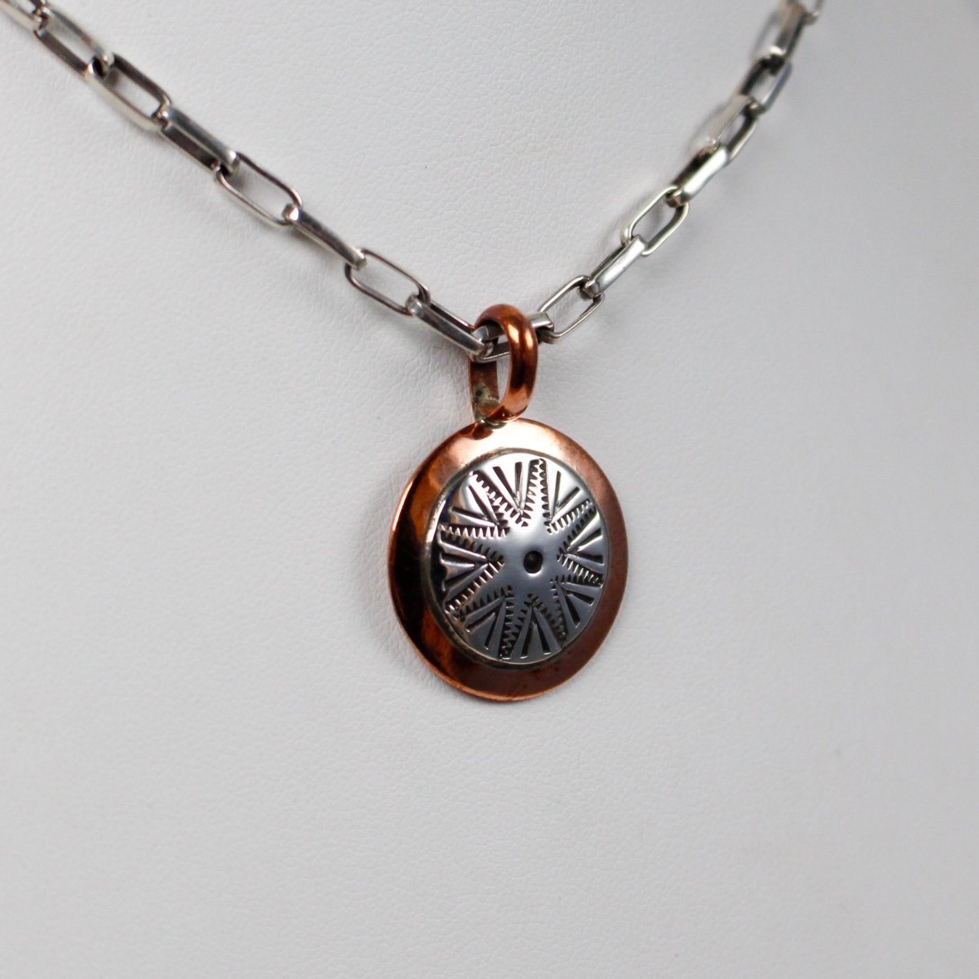 Navajo Round Stamped Sterling and Copper Pendant