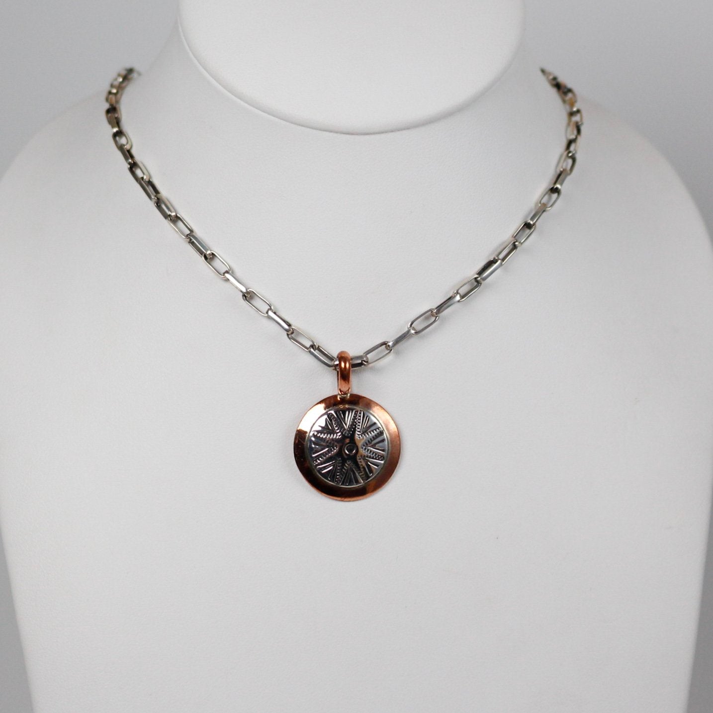 Navajo Round Stamped Sterling and Copper Pendant