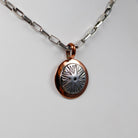 Navajo Round Stamped Sterling and Copper Pendant