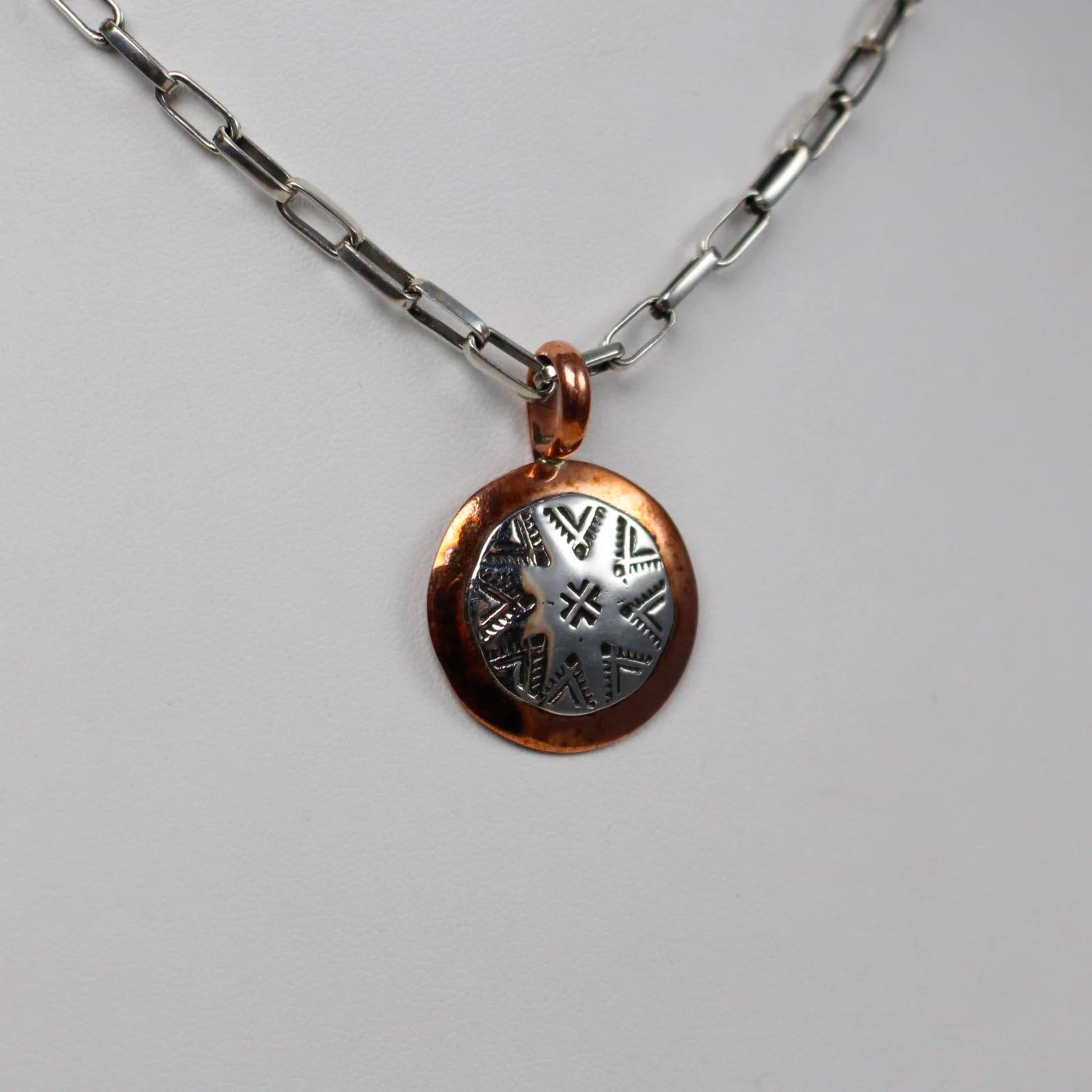 Round Stamped Sterling and Copper Pendant