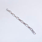 A silver chain link bracelet with elongated oval links and a hook clasp, shown diagonally on a plain white background.