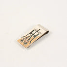 Sterling silver money clip with a black design on a light gray background